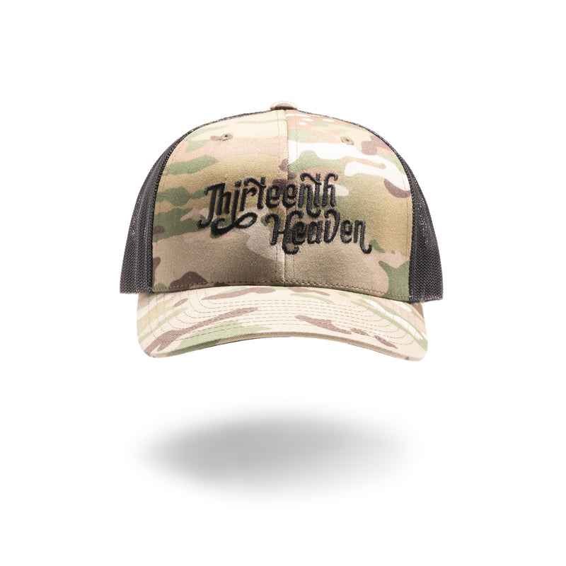 13HVN Script Multicam Trucker cap with embroidered Thirteenth Heaven script logo on black mesh back